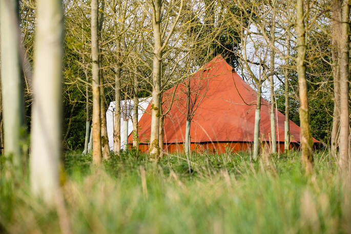 Bell tent through the trees