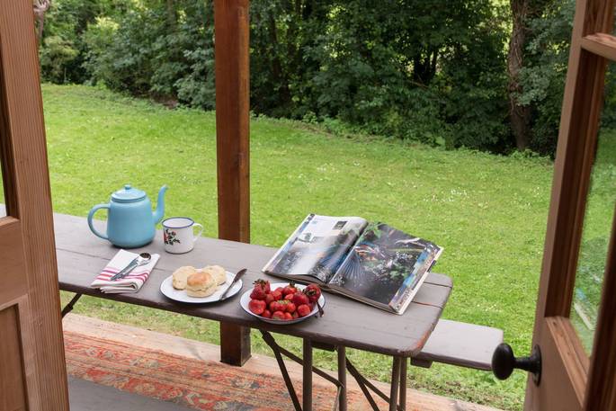 Eat breakfast al fresco style looking onto the babbling brook at St Catherine Tea Pavilion in Bath
