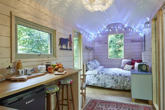 hazel tree cabin cosy cabin hot tub kitchen and bedroom with king size bed