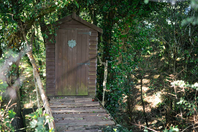 The wooden clad bathroom hut at Mill Valley Farm in Cornwall