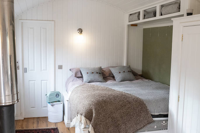 Comfortable king-size bed inside Ragnarr at Spring Park in Cornwall