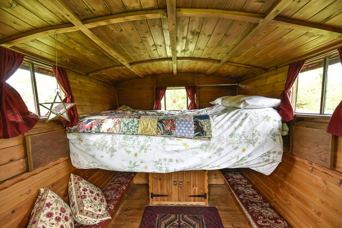 Cosy double pull out bed at Evelyn Wagon, Drybeck Farm, Cumbria