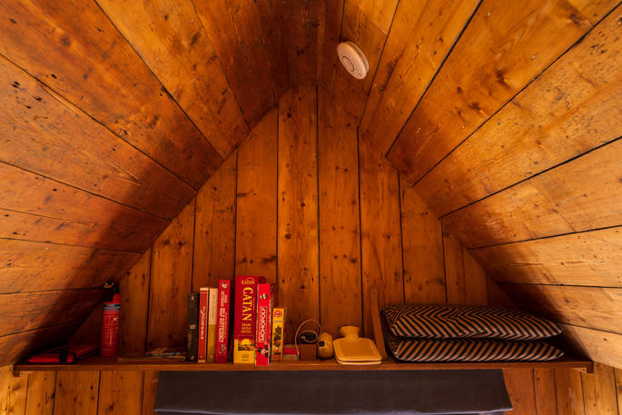 Hinterlandes Hidden Hut cabin books and games, Lake District, Lorton, Cumbria