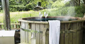 Relax and soak in the wood fired hot tub at Berridon Farm after a long day of exploring