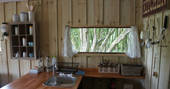 Enjoy beautiful woodland views through your kitchen window at Northcott safari tent, Berridon Farm, Devon