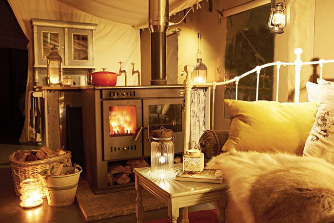 Settle in for the night with the woodburner roaring inside Bovey safari tent. Gather together as you listen out for owls hooting as darkness decends