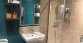 Hill's Cross Hide cabin bathroom with shower, Stockland, Honiton, Devon