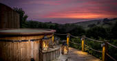 Hot tub with sunset view at Longlands safari tents at Combe Martin, North Devon
