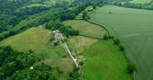 Westley Farm aerial view with yurts in the tress