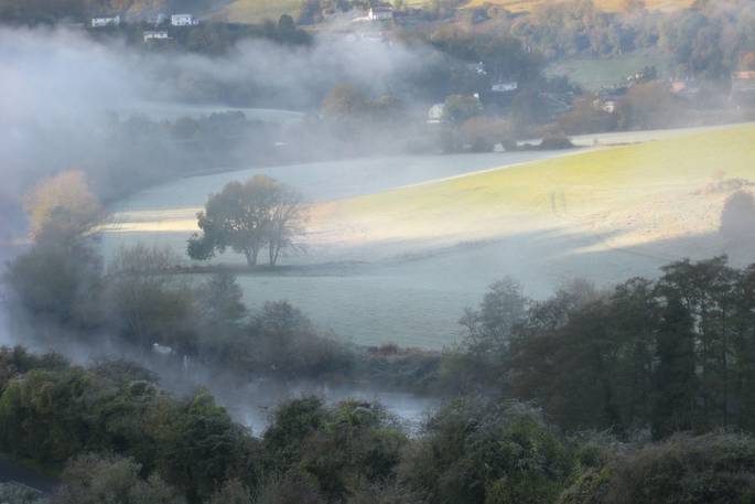 Mist over the countryside near Ragmans Lane Farm in Gloucestershire