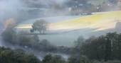 Mist over the countryside near Ragmans Lane Farm in Gloucestershire