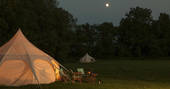 Munday's Meadow lotus belle tents camp - during the night, Wildwood Bluebell, Donnington, Gloucestershire