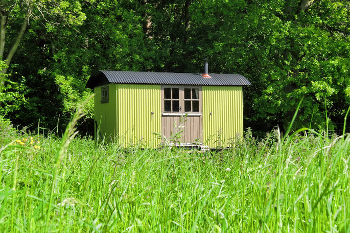 Vibrant shepherd’s hut, Boundary, in the fields at Wriggly Tin at Hampshire