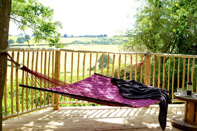 hammock on deck with view of malvern hills 