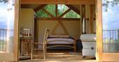 tree cabin herefordshire interior wood burner and king size bed