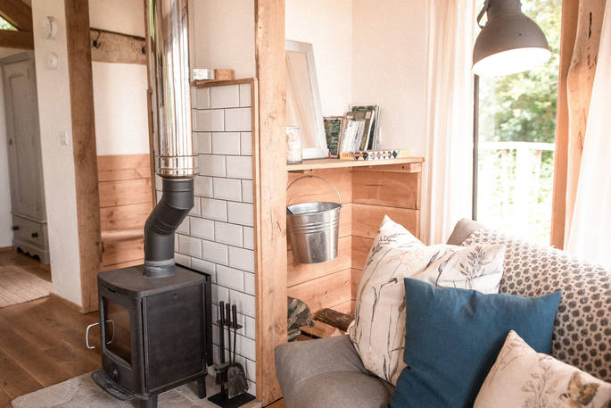 Cosy up by the log burner at Venn Treehouse in Herefordshire