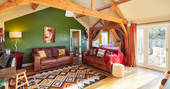 Mosaic Cabin living room with piano, Herefordshire Hideaways, Ledicot, Shobdon, Herefordshire