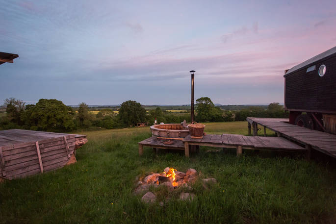 Campfire overlooking countryside