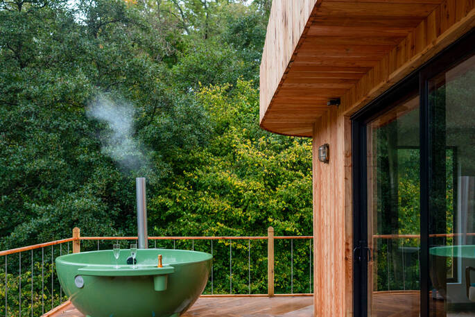 Wood fired hot tub overlooking the trees