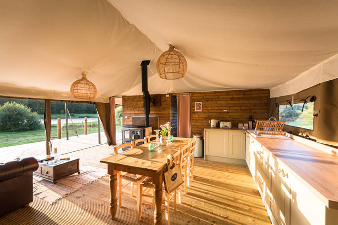 Open plan kitchen and living area space inside your safari tent at The Nest in Lincolnshire