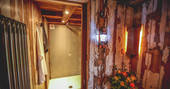 Bathroom with flushing toilet and hot shower at Rowan cabin in Northumberland