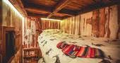 Bunk beds for the kids tucked away under Rowan cabin's mezzanine level in a cool cubbyhole