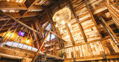 Rowan wilderness cabin in Northumberland interior with mezzanine level up in the timber rafters
