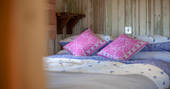 King-size bed inside Dunmore at Huts in the Hills in Northumberland