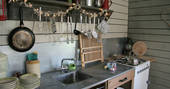 Fully equipped kitchen inside The Coach House Cabin in Somerset