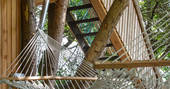 Relax in the hammock and watch the trees sway at Orchard Rooms Treehouse in Somerset