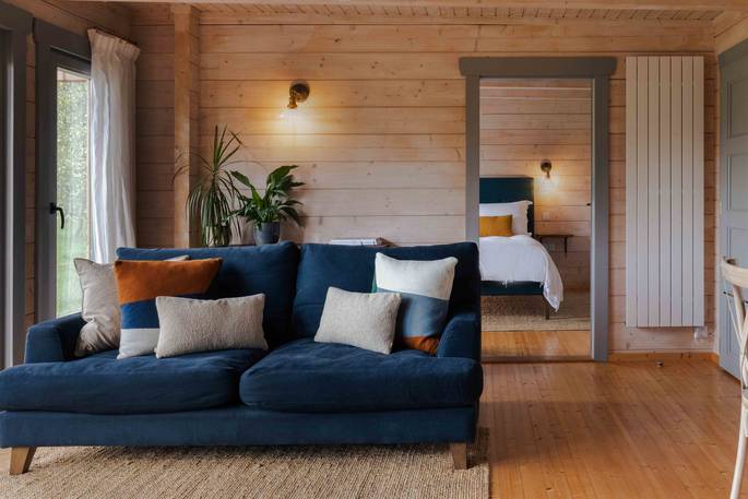 Red Pippin Lodge cabin sofa, Laxfield, Suffolk, England