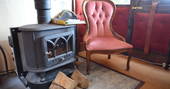 Light the wood-burner and relax inside The Victorian Railway Carriage at Coppins Farm in Suffolk