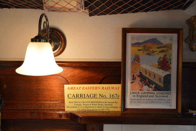 Lighting and decor inside The Victorian Railway Carriage at Coppins Farm 