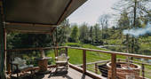 Sit outside of The Woodmans Lodge and fire up the hot tub at The Lost Garden Retreat in Suffolk