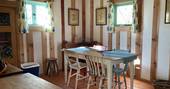Jacaranda Cabin interior dining area, Forest Garden, Ashurstwood, East Sussex
