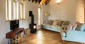 Living room with sofas and wood burner