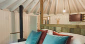 Kick back on the bed and admire the crafted Sussex Round House in Sussex