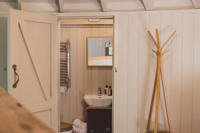 The bathroom with toilet and shower at Sussex Round House in Sussex