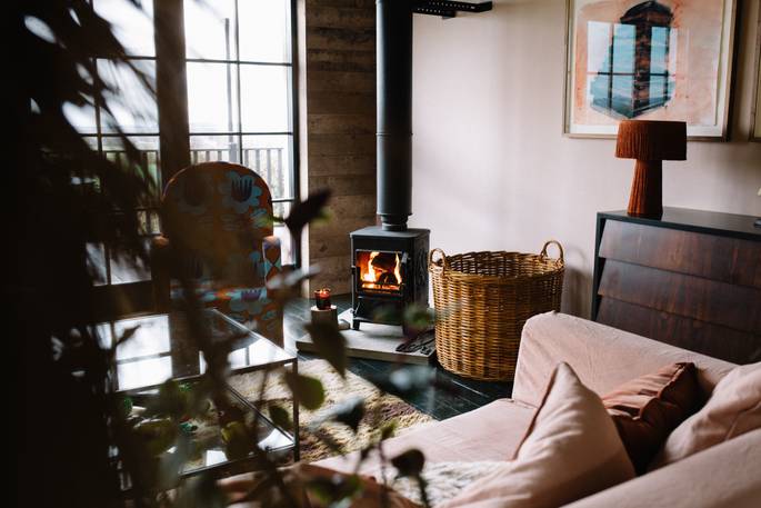 The Artist's House cottage living room with wood burner, Wilkieston, Edinburgh, Scotland