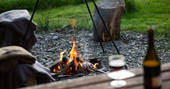 Gather together around the campfire at One Cat Farm in Ceredigion, Wales