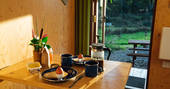 Set up the table and have breakfast for two at Derwen Den in Ceredigion, Wales