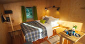 Snuggle up in your duvet and let the sun shine in at Derwen Den in Ceredigion, Wales