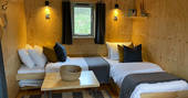 The Den cabin - sofas convered into single beds, One Cat Farm, Lampeter, Ceredigion, Wales