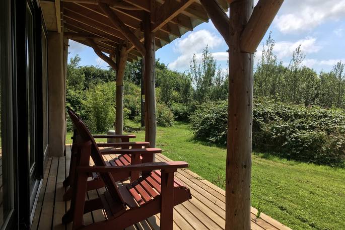 Sit outside on the decking of The Stoep at Wildernest in Ceredigion