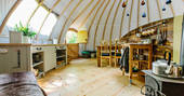 The fully-equipped kitchen and dining area at The Park tent, Penhein Glamping in Monmouthshire