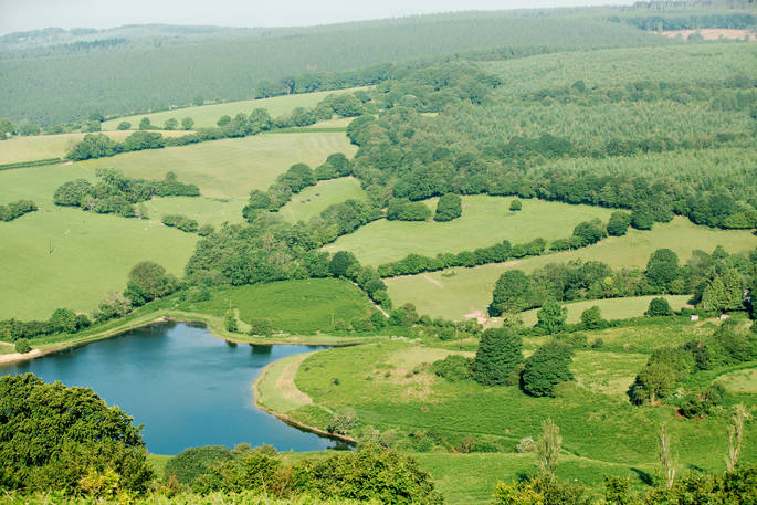 Beautiful aerial view of the reservoir and Monmouthshire countryside near Penhein Glamping