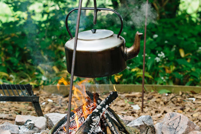 Kettle boiling on the firepit at Penhein Glamping in Monmouthshire