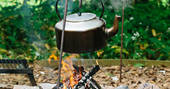 Kettle boiling on the firepit at Penhein Glamping in Monmouthshire