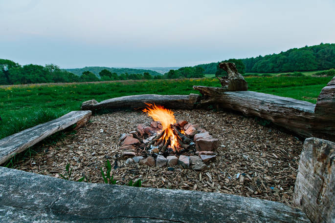 Cuddle up by the cosy firepit and toast marshmallows at Penhein Glamping in Monmouthshire