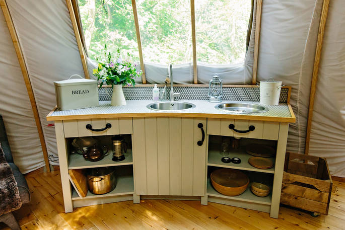 The fully-equipped kitchen area inside The Slades tent at Penhein Glamping in Monmouthshire